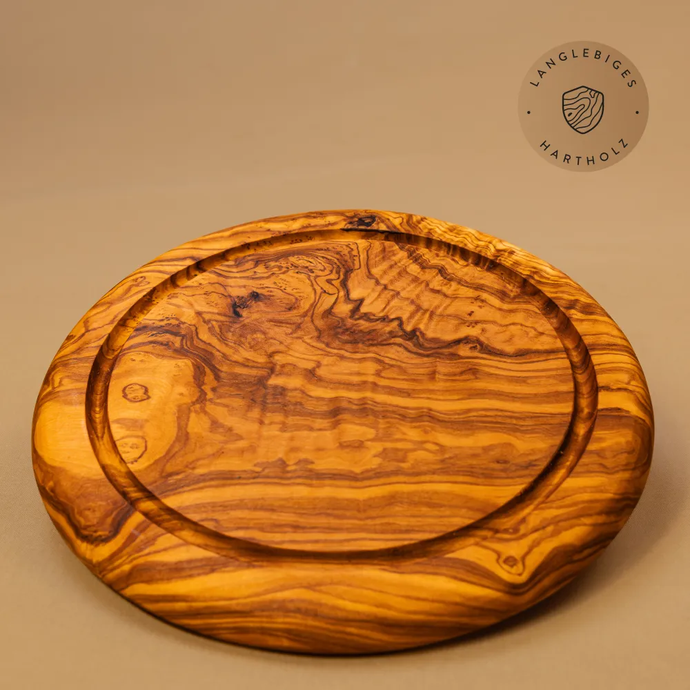 Rundes Schneidebrett aus Olivenholz mit Saftrille | ein Klassiker
